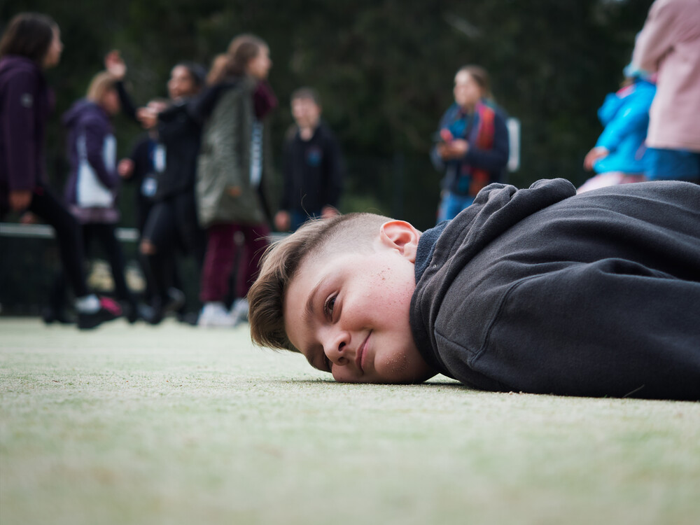 Laying on the ground at the end of camp